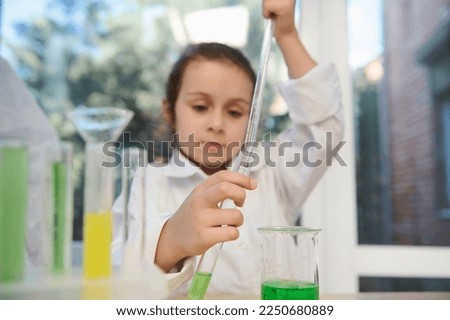 Similar – Image, Stock Photo Happy kid looking liquid through magnifying glass