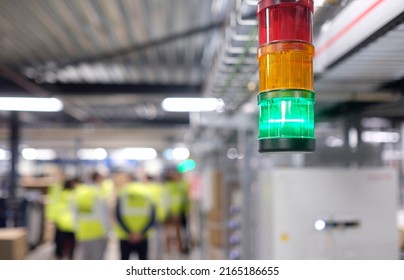 Selective focus on a green light in a manufacturing factory - Shutterstock ID 2165186655