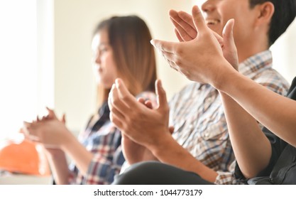 Selective Focus On Hands. Creative Designers Audience Applauding At A Business Seminar. Asian People Listening And Clapping At Conference And Presentation.