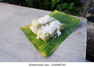 Selective focus on Indonesian Traditional Cake Kue Putu Ayu. Putu ayu with banana leaf background. Indonesian Traditional cake Putu Ayu with coconut and palm sugar. soft Focus