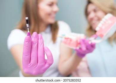 Selective Focus On Interdental Toothbrush In Hands Of Female Dentist