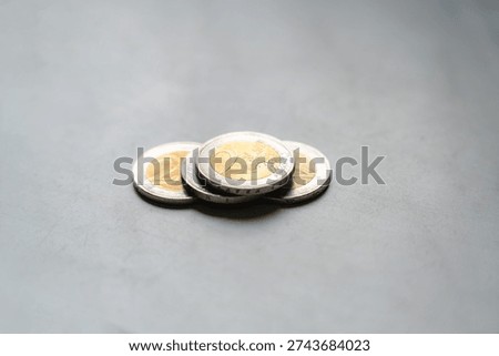 Selective focus on isolated 2 Euro coins laying on table, Two Euros money european currency, Finance, Europe, Business