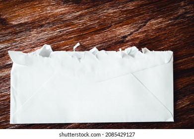 Selective Focus On Jagged Edges Of A Ripped Open Mail Envelope 