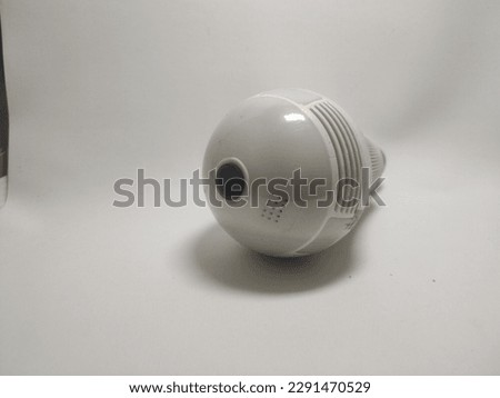Selective focus on light, bulb, CCTV, hidden, spy, so bright, you won't be impressed if it's a white surveillance camera that you need to install like a regular light. no brand, white background