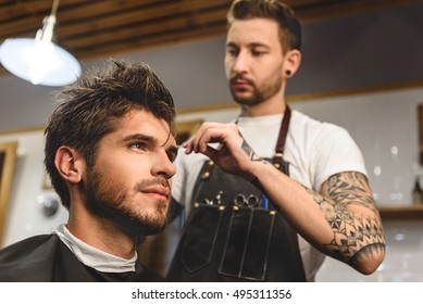 Selective Focus On Man Sitting In Hair Salon