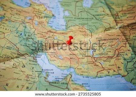 Selective focus on the map of Iran marked with pins