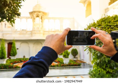 Selective Focus On Moblie Phone Taking Picture Of Traditinal Building In India