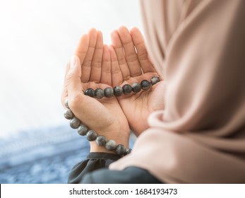 Selective Focus On Moslem Pray, Praying Hands With Rosary Beads Of Muslim Lady.