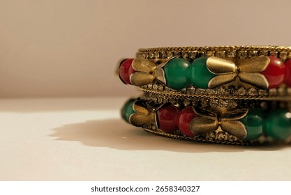 selective focus on a side view of A pair of traditional bangles on white background.