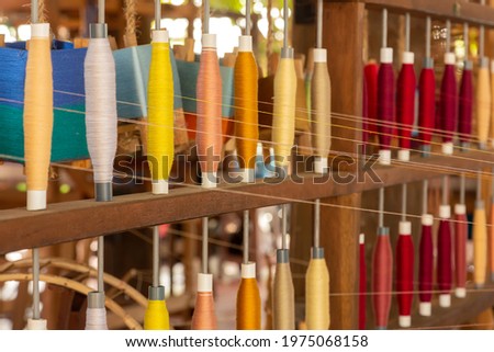 Selective focus on silk threads yarn, handicrafts weaving textile productions in Thailand