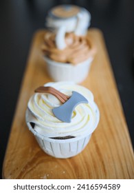 Selective focus on Theme Cupcakes on wooden board, Close-up 