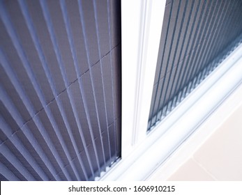 Selective Focus On White Frame Door With Mosquito Net Wire Screen.