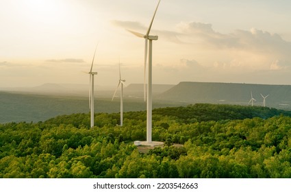 Selective focus on wind farm. Wind energy. Wind power. Sustainable, renewable energy. Wind turbines generate electricity. Windmill farm on mountain. Green technology. Sustainable resources. - Shutterstock ID 2203542663