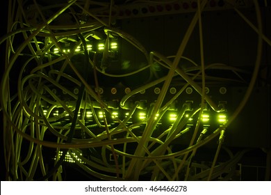 Selective focus. Operating network equipment in the server room. Processing the data stream on the optical channel. Data center in the dark. 