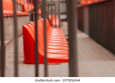 Selective Focus Of Orange Chairs On Stadium, No People.