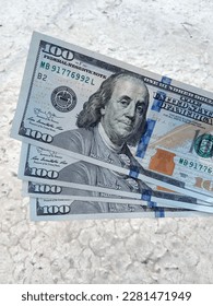 selective focus photo of American dollars  - Shutterstock ID 2281471949