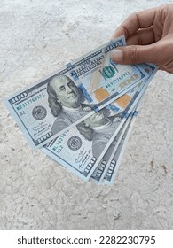 selective focus photo of American dollars  - Shutterstock ID 2282230795
