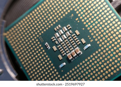 selective focus photo, the back of a processor with pins and transistors
