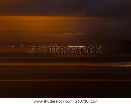 Selective focus photography. A frame in motion. Abstract background. Colorful image. Long shutter speed. Light streaks. Movement of transportation. Shooting from transportation. Blurred image.