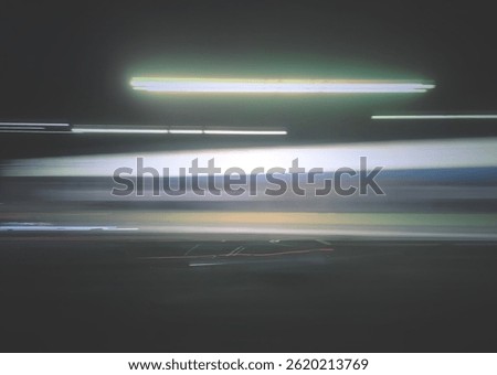 Selective focus photography. A frame in motion. Abstract background. Colorful image. Long shutter speed. Light streaks. Movement of transportation. Shooting from transportation. Blurred image.