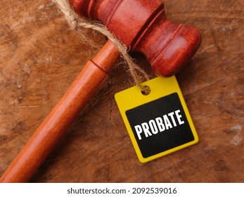 Selective focus phrase PROBATE written on cupboard tag with gavel.