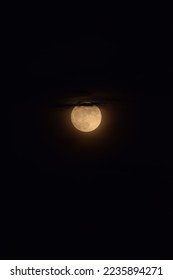 selective focus picture of moon surrounded by clouds 