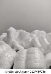 Selective Focus Of Polystyrene Peanuts With Grey Background