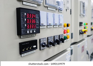 Selective focus the power meter on Electrical switch gear high Voltage motor control center cabinet in power plant,Breaker module,Electrical selector switch,button switch