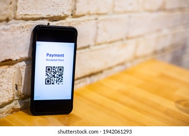 Selective focus to QR code payment on smart phone. The concept of cashless technology or digital payment.