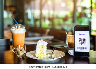 Selective Focus To QR Code Tag On Smartphone With Blurry Soft Drink, Food And  Dessert In Coffee Shop To Accepted Generate Digital Pay Without Money. Qr Code Payment Concept.