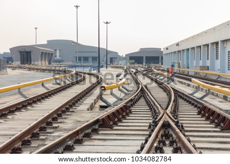 Selective focus of railway to depot on viaduct of sky train which has rail Fastener for hold rail with concrete slab track.