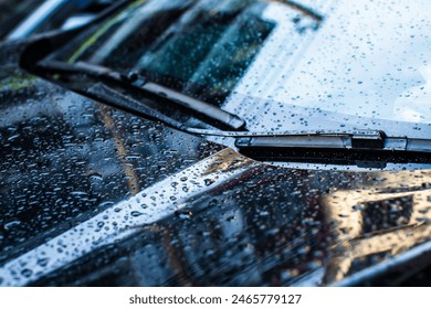 Selective focus to rain droplet with wiper on windshield. Windshield wipers of car, season rain. - Powered by Shutterstock