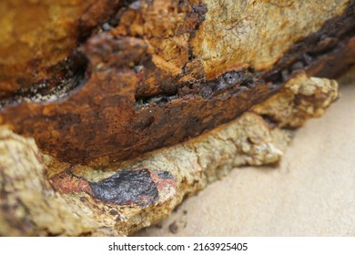 Selective Focus Raw Tin Metal Ore Stuck On The Rock.