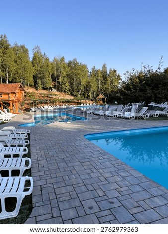 selective focus resort with pools and sun loungers