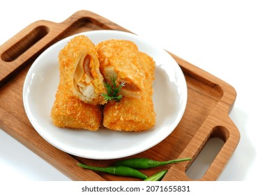 Selective Focus Risoles Sosis Mayo (American Risoles) Or Mayonnaise Sausage Rissole Is A Small Patty Rolled In Breadcrumbs. It Is Filled With Mayonnaise, Boiled Egg And Sausage. Served On White Plate.