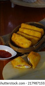 Selective Focus Risoles Sosis Mayo (American Risoles) Or Mayonnaise Sausage Rissole Is A Small Patty Rolled In Breadcrumbs. It Is Filled With Mayonnaise, Boiled Egg And Sausage. Served On White Plate.