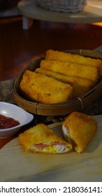 Selective Focus Risoles Sosis Mayo (American Risoles) Or Mayonnaise Sausage Rissole Is A Small Patty Rolled In Breadcrumbs. It Is Filled With Mayonnaise, Boiled Egg And Sausage. Served On White Plate.