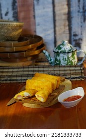 Selective Focus Risoles Sosis Mayo (American Risoles) Or Mayonnaise Sausage Rissole Is A Small Patty Rolled In Breadcrumbs. It Is Filled With Mayonnaise, Boiled Egg And Sausage. Served On White Plate.