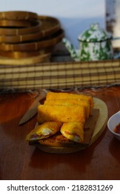 Selective Focus Risoles Sosis Mayo (American Risoles) Or Mayonnaise Sausage Rissole Is A Small Patty Rolled In Breadcrumbs. It Is Filled With Mayonnaise, Boiled Egg And Sausage. Served On White Plate.