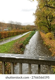 selective focus river flow with fast moving water in natural landscape