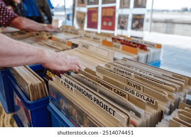 Selective focus at second hand vinyl discs at the stall in open air market in Düsseldorf, Germany.  