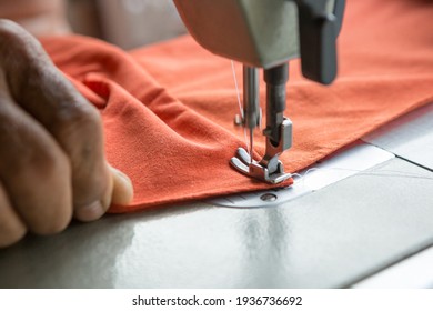 Selective Focus Of Sewing Machine And Blurred Hands And Copy Space