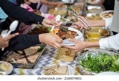 Selective Focus Shot Of Food Being Served On Paper Plate During Hari Raya Party In Kuala Lumpur, Malaysia. 