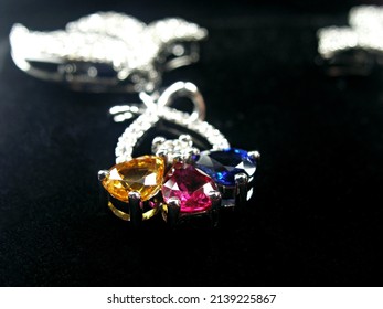 Selective focus silver Jewellery setting pendant with natural precious fancy sapphire gemstones pear shape cutting.