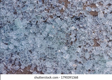 Selective Focus Of Small Pieces Of Broken Glass On The Ground At Bus Station, Particles Of Shattered Glass On The Floor, Abstract Pattern Background.