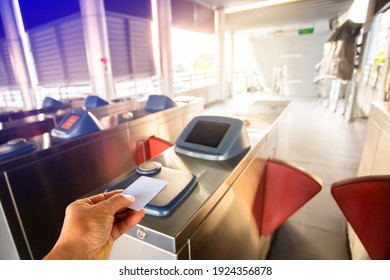 Selective Focus To Smart Card In Hand Of Passenger Using To Open Automatic Gate Machine At Sky Train Station. Modern Automatic Ticket. Access Control Passenger Of Transportation Concept.