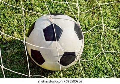 Selective focus of soccer ball in goal, Close up image