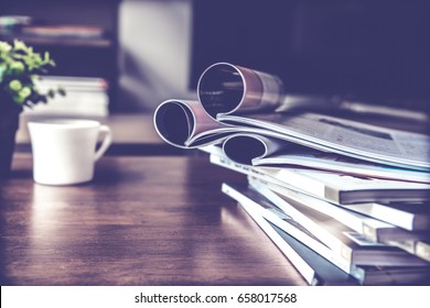 selective focus of the stacking magazine place on table in living room - Shutterstock ID 658017568