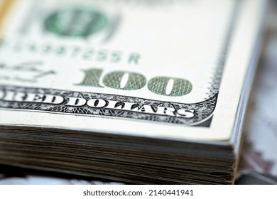 Selective Focus Of Stacks Of American Money Banknote Background, A Close Up Of 100 $ One Hundred American Dollars Bill Collected Together With A Rubber Band, Pile Of American Dollars Bills