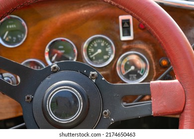 selective focus of steering wheel and dashboard of classic car.